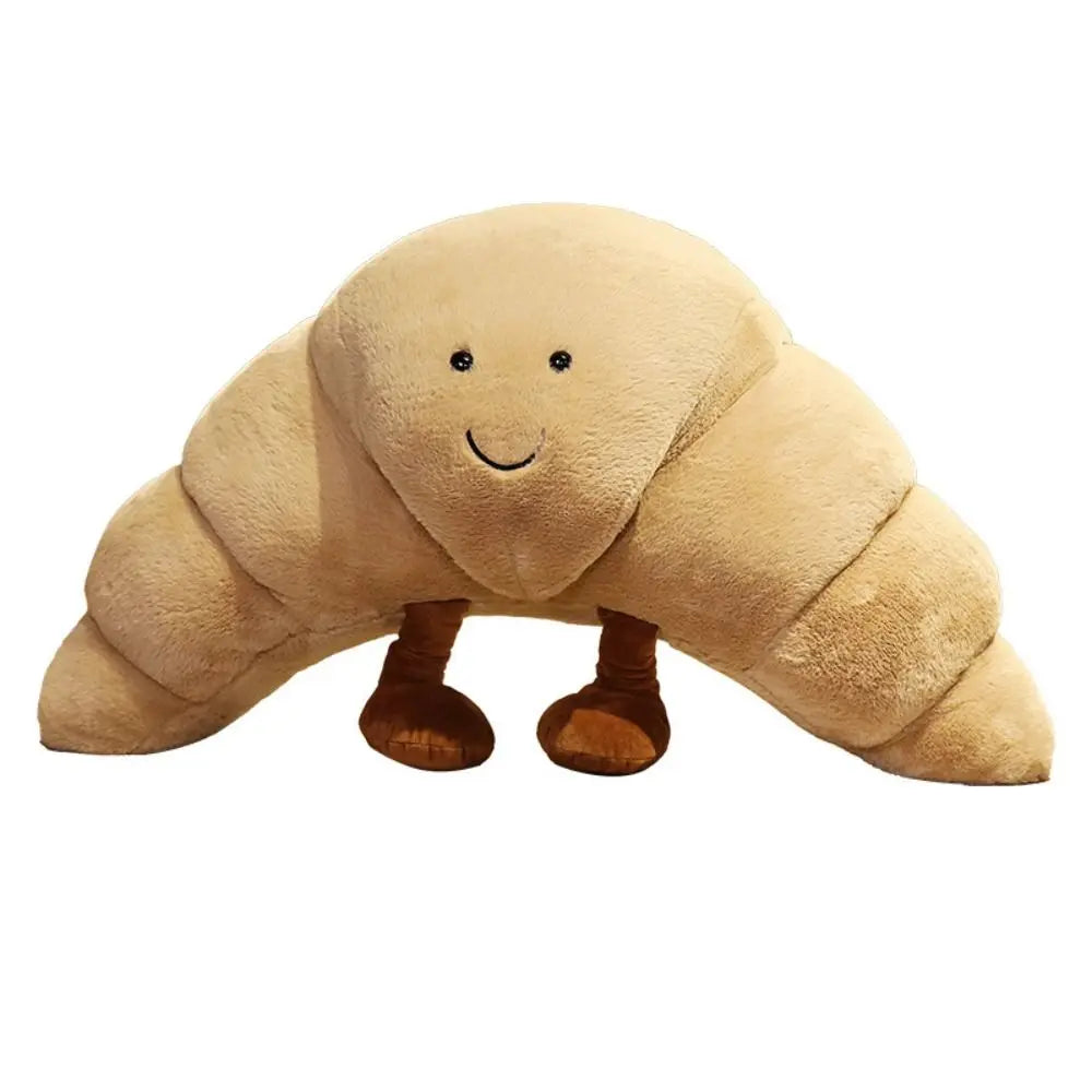 Cojín Peluche Croissant 33 cm – Suave, marrón claro, con carita sonriente