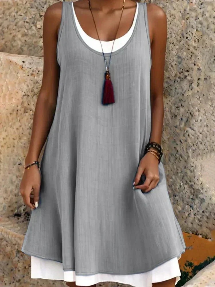 Vestido mini de mujer con efecto superpuesto: estilo elegante sin mangas y cuello redondo