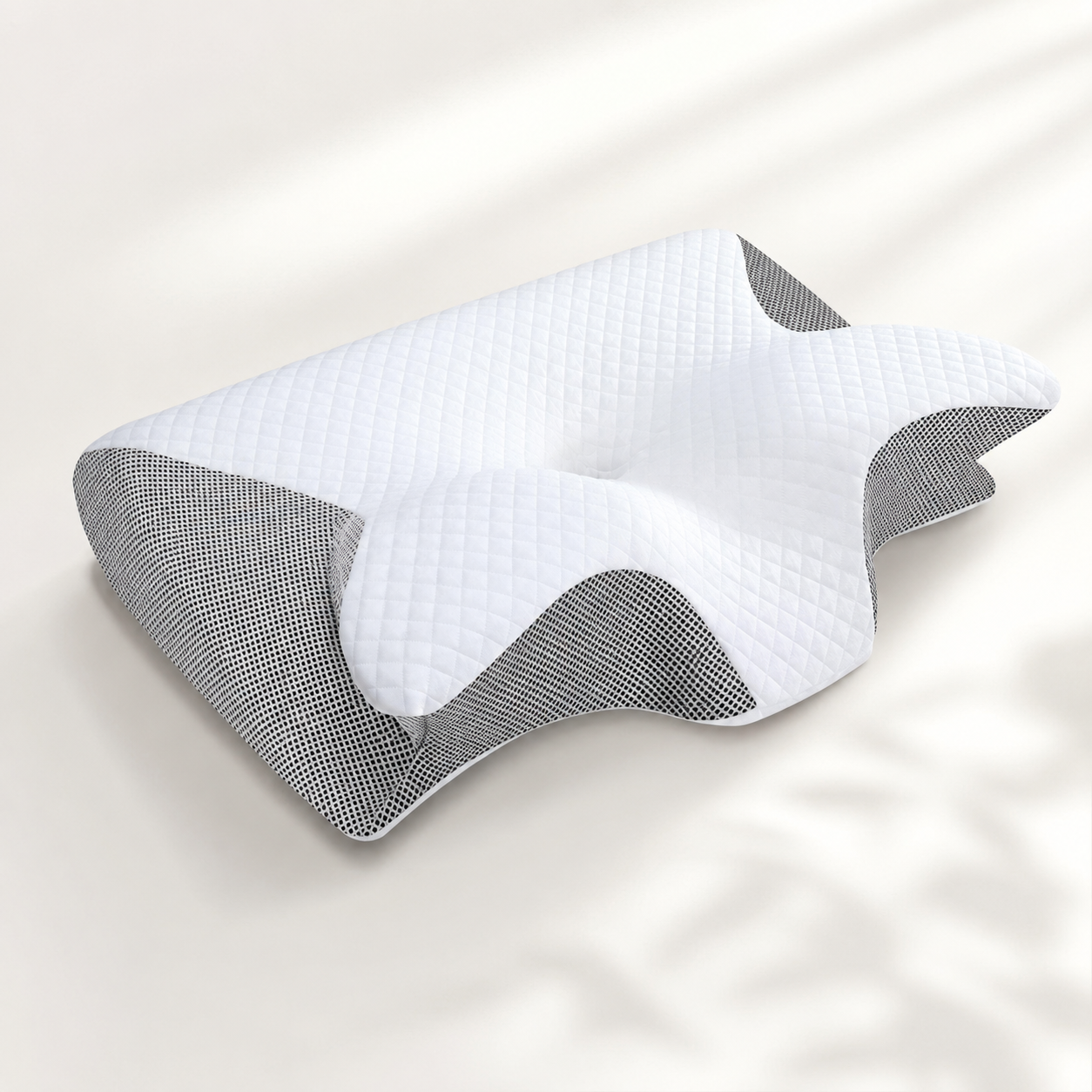 Almohada cervical ortopédica de espuma viscoelástica con diseño de contorno ergonómico sobre fondo neutro